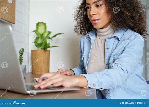 African Teen Girl Distance Learning Online Watching Webinar On Laptop
