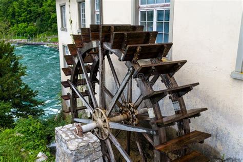 Working A Wooden Water Wheel For Converting The Energy Of Flowing