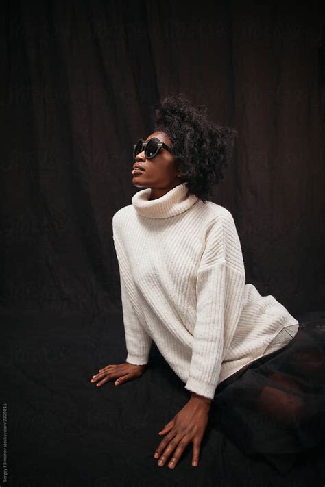 Black Model In Sunglasses And Sweater Del Colaborador De Stocksy