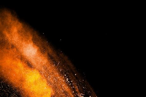 Premium Photo Abstract Orange Powder Explosion On Black Background