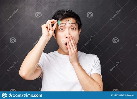 Close Up Portrait Of Impressed Astonished Asian Guy Take Off Glasses From Amazement Cover