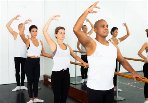 Warm Up Sessions At Bench Women And Men Doing Ballet Stock Photo