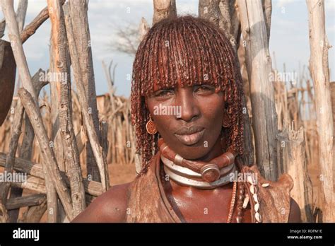 Young Hamar Woman With Traditional Hairstyle With Red Clay In Her Hair