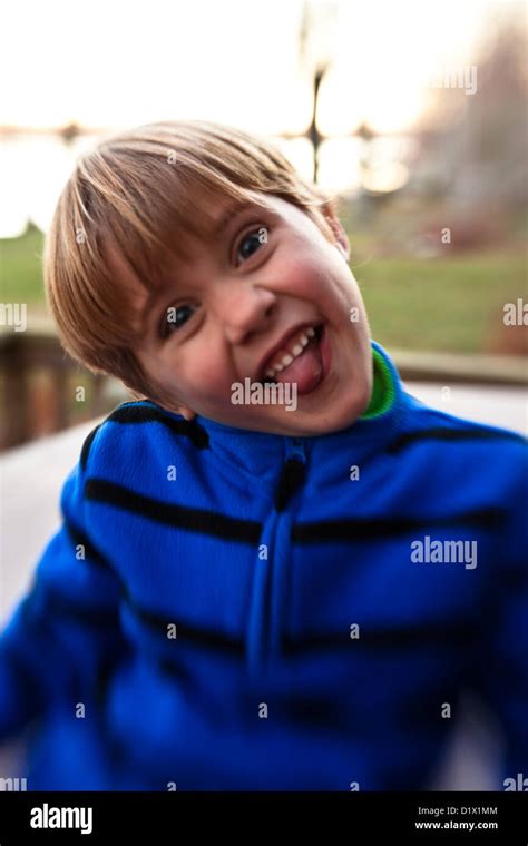 Little Boy Making Faces And Being Silly Outside Of His House Stock