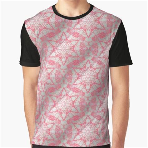 A Pink And White Graphic T Shirt With An Abstract Design On The Chestline