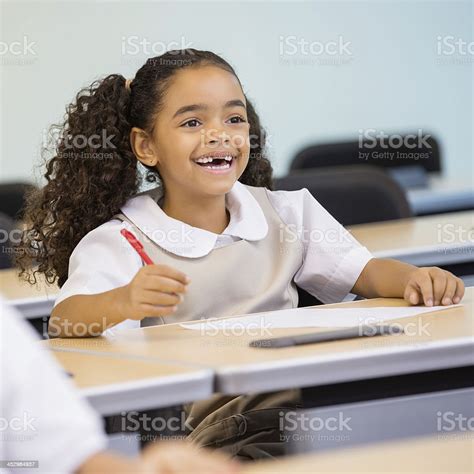 Cute Elementary Age Girl In Private School Uniform Stock Photo