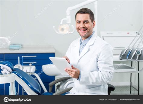 Happy Dentist White Coat Holding Digital Tablet Dental Clinic Stock