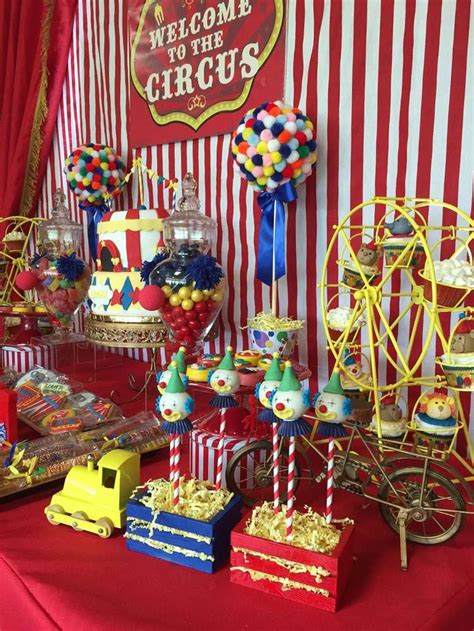 A Carnival Themed Dessert Table With Candy Candies And Lollipops