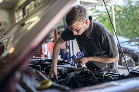 Mechanic Working On Car With Bonnet Open Stock Image F0093456
