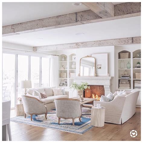 The sofa is ideally taking up a command position. my white sofas. two white sofas facing each other. two ...