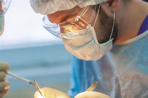 Baldness Treatment Hair Transplant Surgeons In The Operating Room