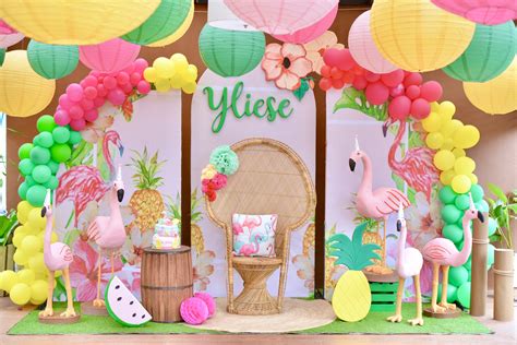 A Tropical Themed Birthday Party With Flamingos Pineapples And Paper