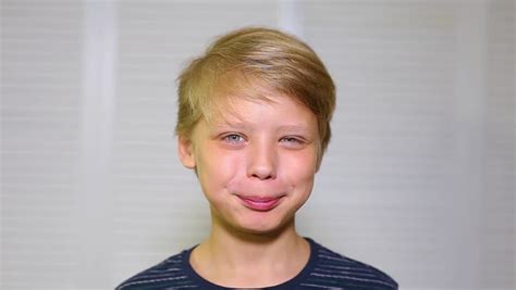 Closeup Portrait Of Cute Funny 10 Year Old Boy With Long Blond Hair