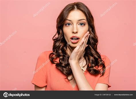 Shocked Young Woman Touching Face While While Looking Camera Isolated