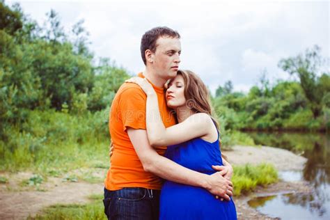A Guy And A Pregnant Woman Near The Water Stock Image Image Of Looking Couple 91105881