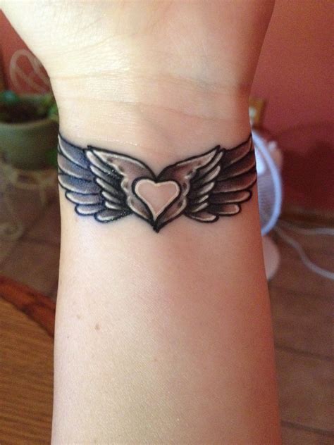 My Angel Wing Tattoo With A Heart In The Middle Wing Tattoos On Wrist