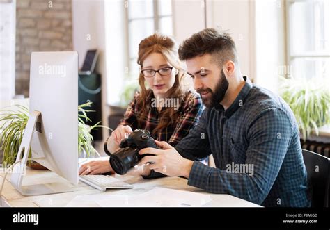 Two Young Designers Working In Modern Office Stock Photo Alamy