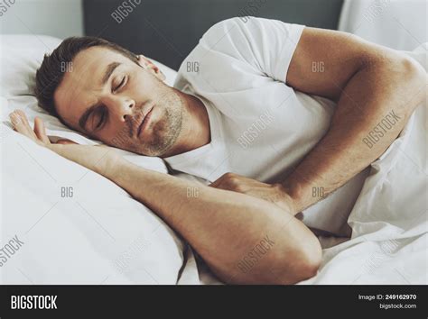 handsome man sleeping image and photo free trial bigstock