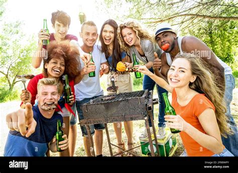 Happy Multiracial Friends Having Fun At Picnic Barbecue Garden Party