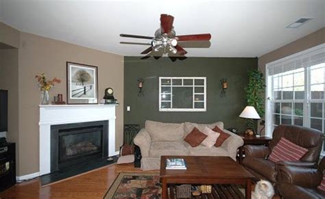 An accent wall is one that's painted or wallpapered differently than the others in a room. Chris's room | Accent walls in living room, Dark accent ...