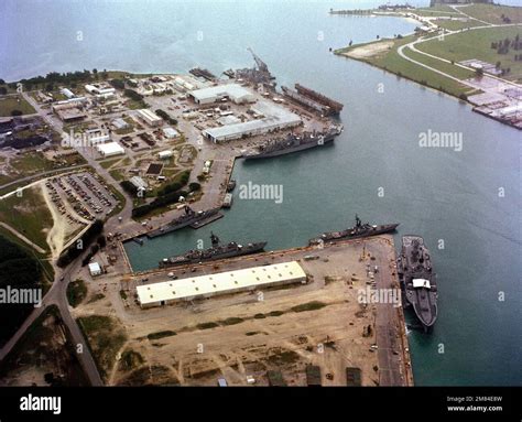An Aerial View Of Various Ships Moored In The Harbor At The Us Naval Ship Repair Facility Base