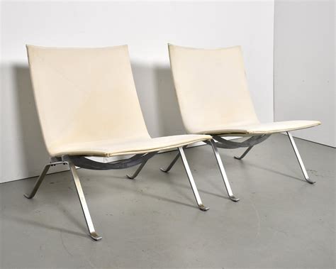 Pair of PK lounge chairs by Poul Kjærholm for E Kold Christensen