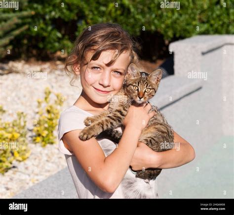 Young Girl Cat In Arms Hi Res Stock Photography And Images Alamy