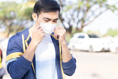 Closeup Man Wearing Face Mask For Protect Air Polution Or Colona Virus
