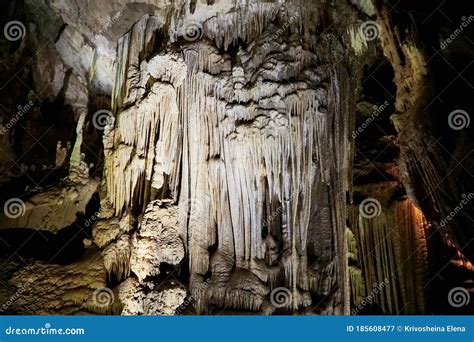 Beautiful Colorful And Illuminated Cave With Stalactites And