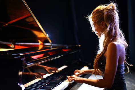 Woman Playing Piano In A Concert Stock Photo Download Image Now