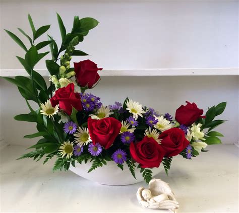 one of our unique crescent arrangements available at edwards flowerland contemporary flower