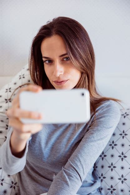 Free Photo Attractive Woman Taking Selfie In Bed