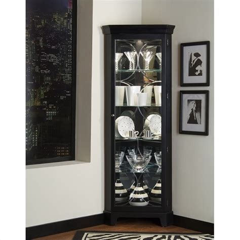Corner curio cabinet is the perfect option to display your collectives. Pulaski Oxford Black Corner Curio Cabinet - 21220