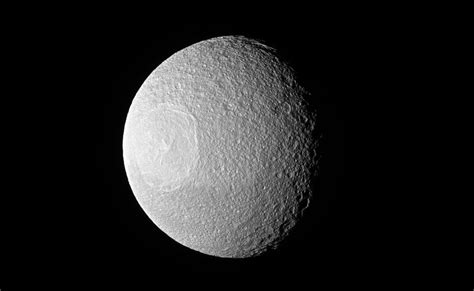 Saturns Battered Moon Tethys Gets A Closeup From Cassini Space