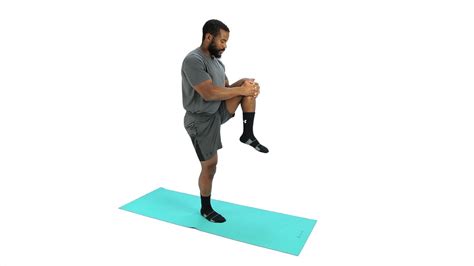 How To Do Standing Knee Hug Stretching Demo Youtube