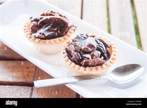 Crispy Chocolate Tarts On White Plate Stock Photo Stock Photo Alamy