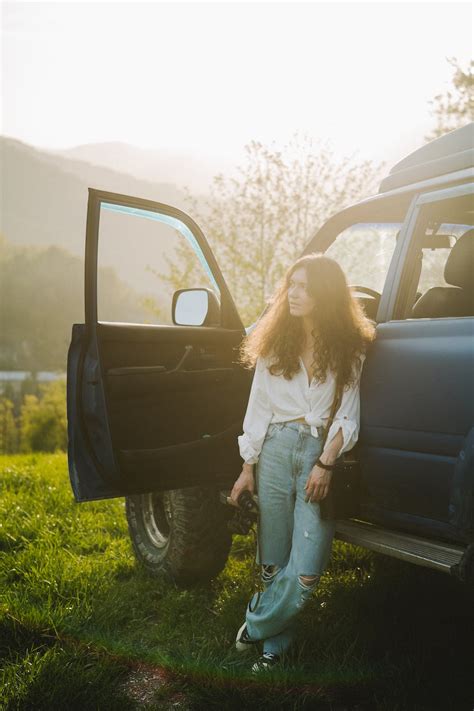 A Woman Leaning On Her Car · Free Stock Photo