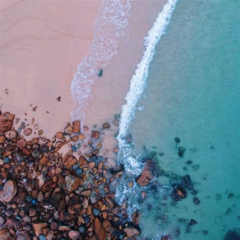 Download Wallpaper 2780x2780 Ocean Beach Aerial View Sand Stones