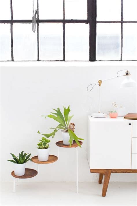This plant stand has a lot of space for potted plants, so it can fit as many as possible. 15 DIY Plant Stands to Fill Your Home With Greenery