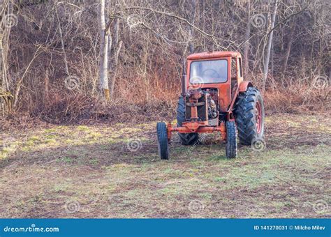 Old Rusty Red Antique Tractor From A Farm In The Woods Stock Image