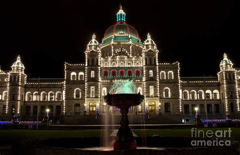 Victoria Parliament Buildings And Fountain At Christmas Photograph By