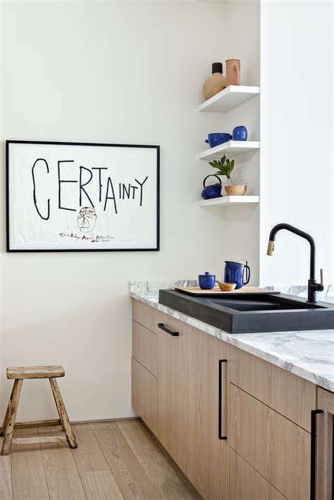 The black and white color palette is timeless and simple, while the silhouettes of the round table and chairs give off a modern vibe. Apartment kitchen renovation, small kitchen, Artwork by Tony Kaye | Modern kitchen apartment ...