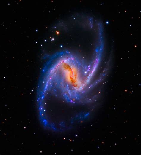 ngc 1365 also known as the great barred spiral galaxy is a barred spiral galaxy about 56