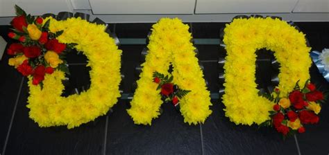 Choosing floral tributes for funerals is something every person has to do eventually. dad tribute in yellow, red and black | Funeral flowers ...