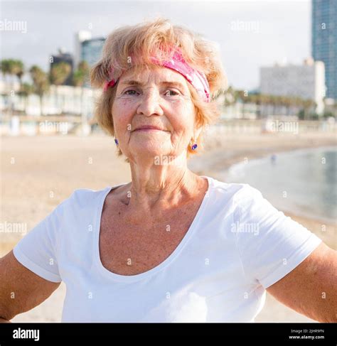 Waist Up Portrait Of Mature Sportswoman On Beach Stock Photo Alamy