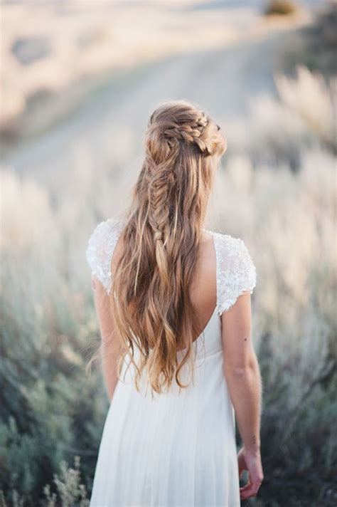 This bride has created an elaborated knot to make her half up more special. 40 Stunning Half Up Half Down Wedding Hairstyles with ...