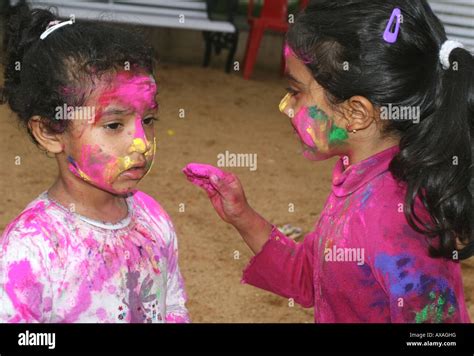 Two Young Indian Girls Playing Holi At The Indian Spring Festival Holi