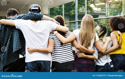 Smiling Happy Young Adult Friends Arms Around Shoulder Outdoors Stock