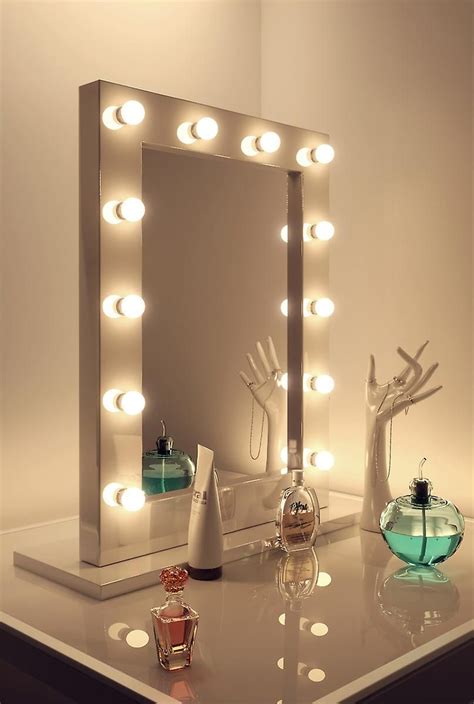 A metal stand (white/black) has a flat foot. Lighted Makeup Mirror Free Standing | Premium Vanity 24