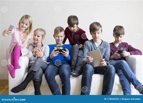 Kids Using Their Gadgets Stock Photo Image Of Children 178649426